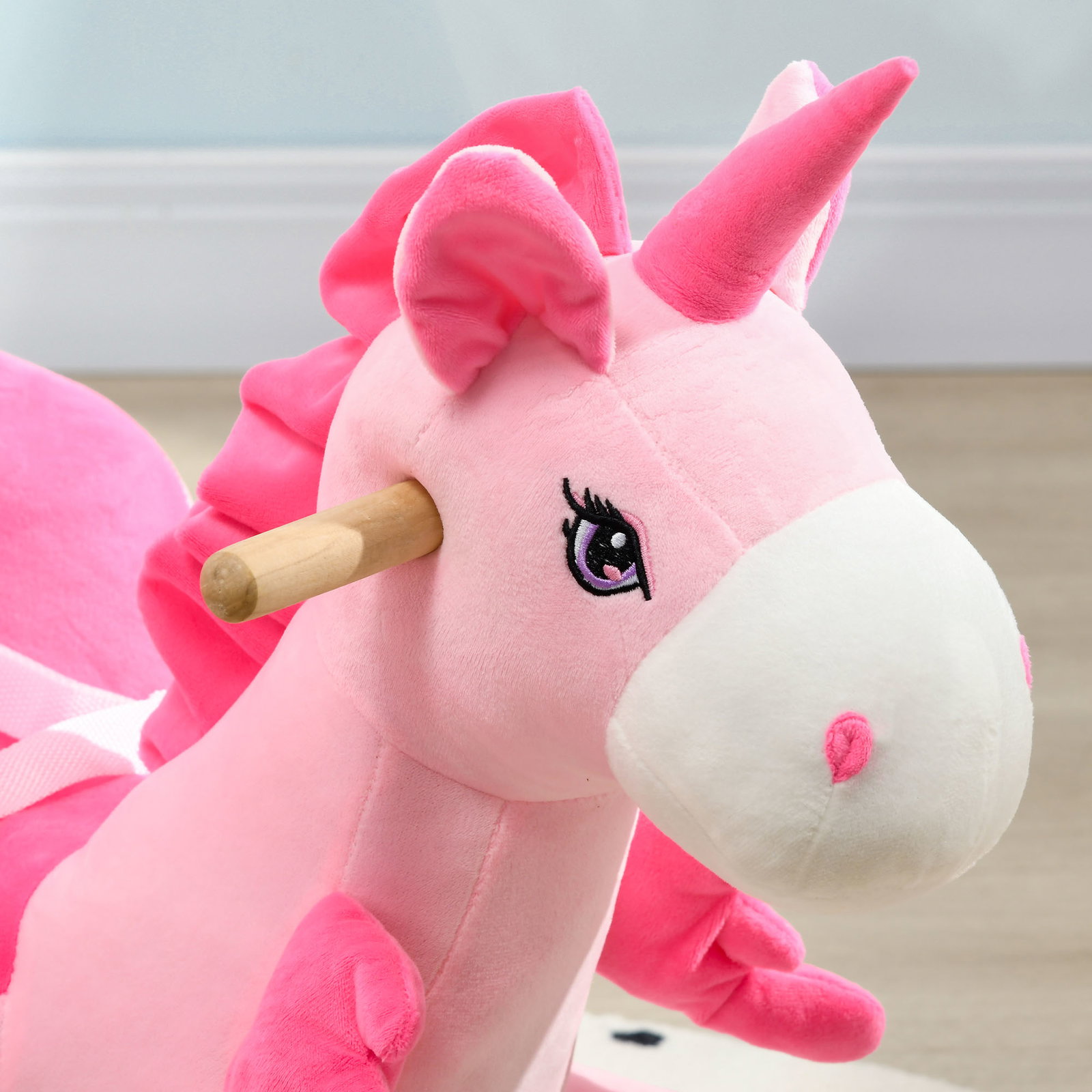 Cavalo baloiço para bebés baloiço em forma de unicornio com música cinto de segurança e apoio para os pés 65x35x45 cm rosa